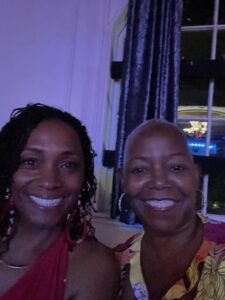 Two African-American women smiling brightly