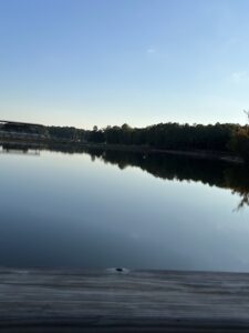 View of lake with sky and sun