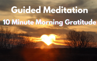 Image of the sun rising in the shape of a heart under over a field with trees on both sides. Text in white: Guided Meditation 10 Minute Morning Gratitude